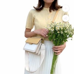 Yellow and white purse